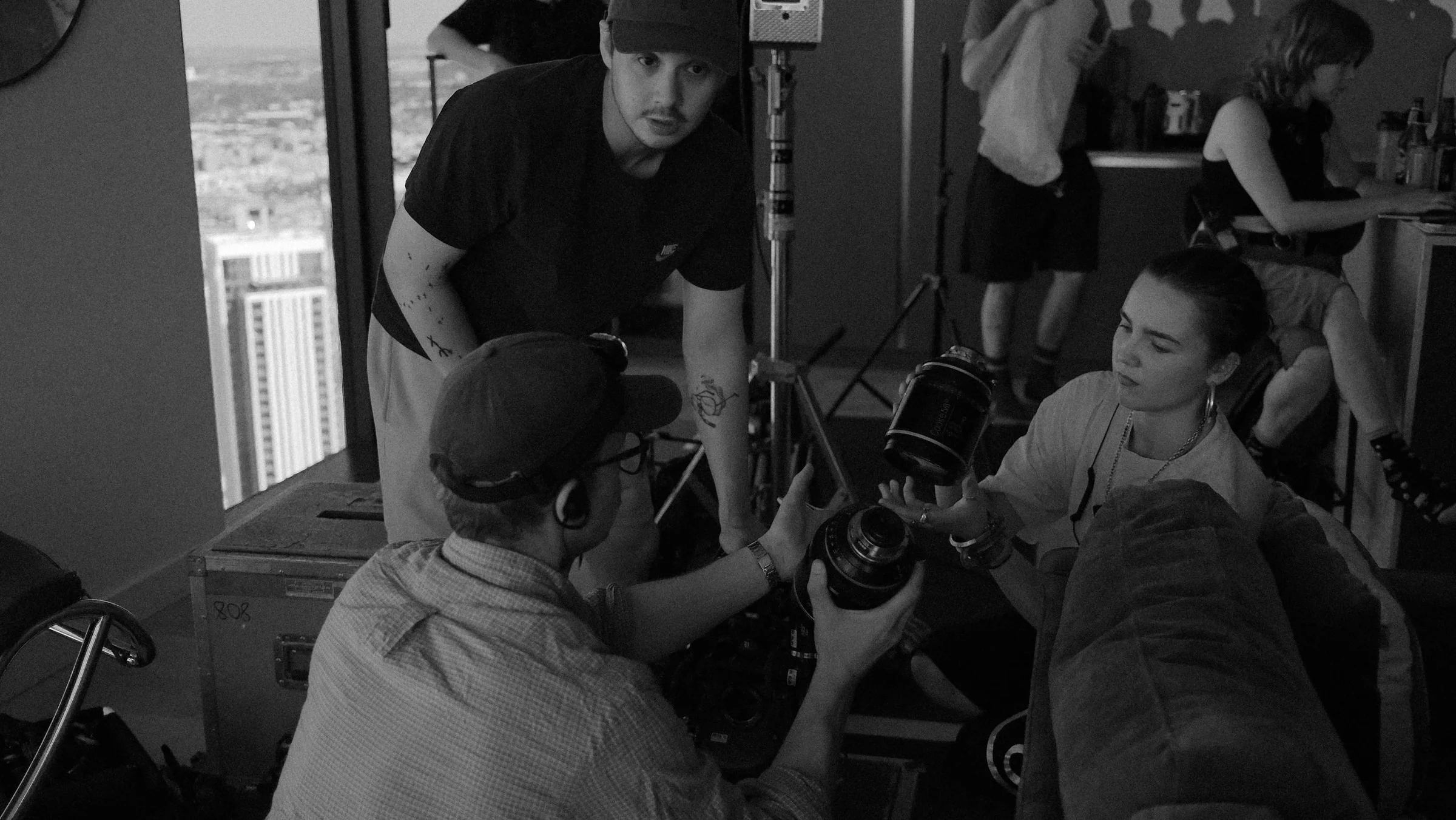 Crew gathered around a camera during a setup