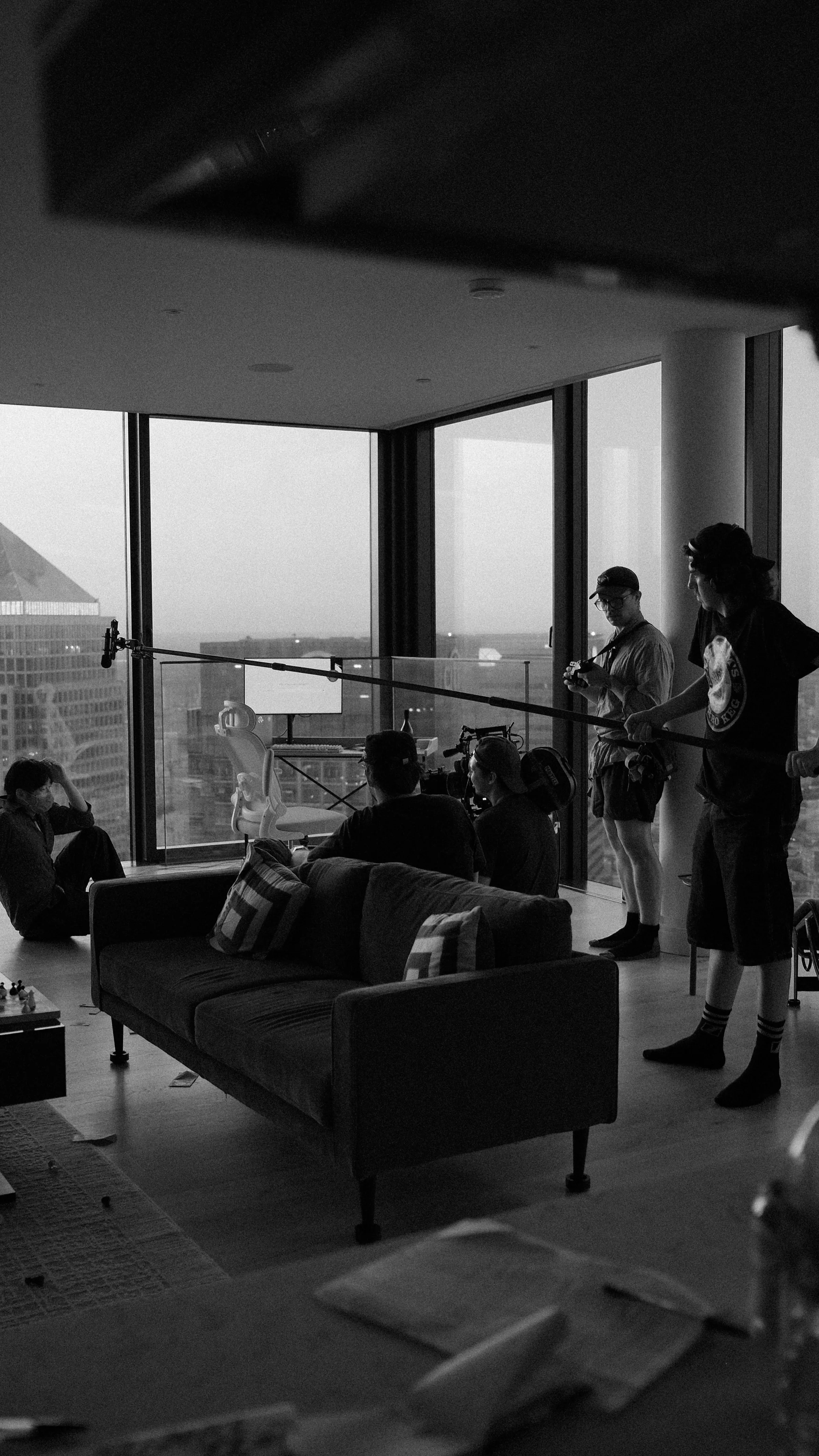 Crew working around a jib arm in a high-rise interior