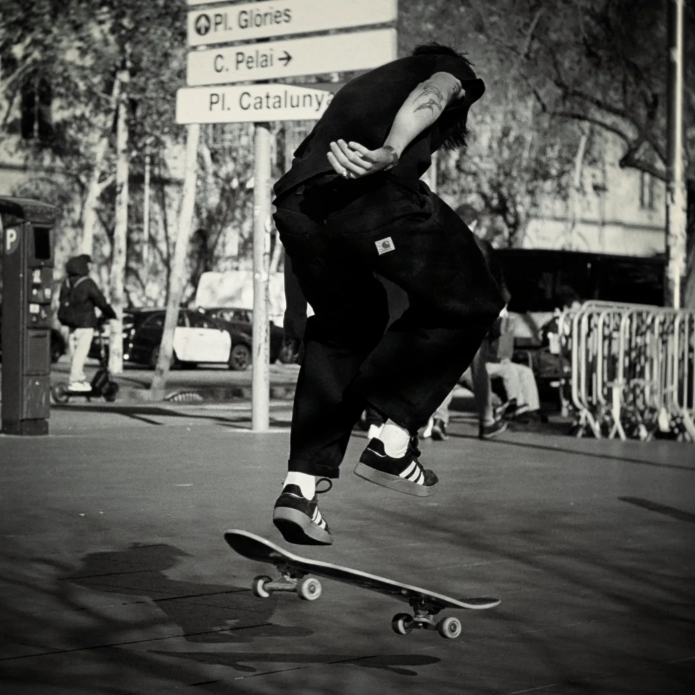 Skateboarder performing a trick near Plaça de Catalunya in Barcelona